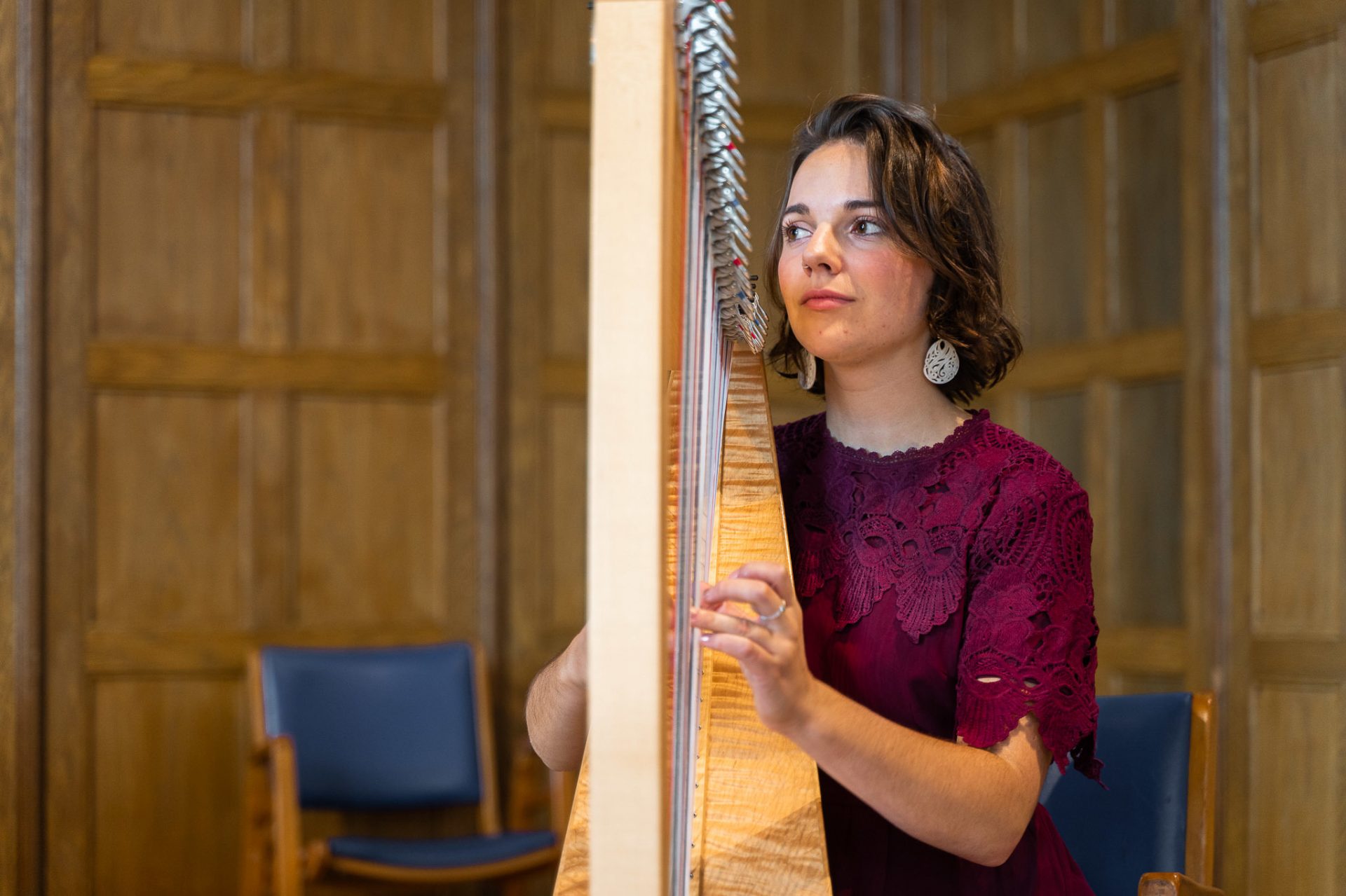 A harpist playing her harp