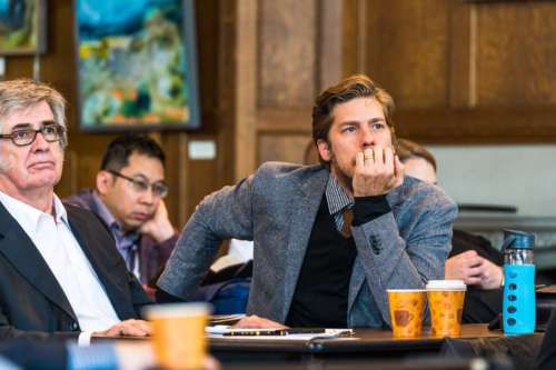 A student leans in to a presentation