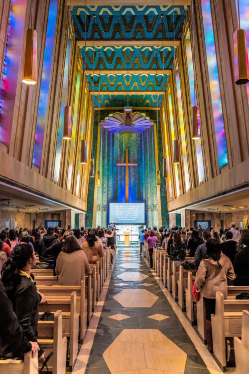 Beautiful colours spill through the stained glass windows of a cathedral