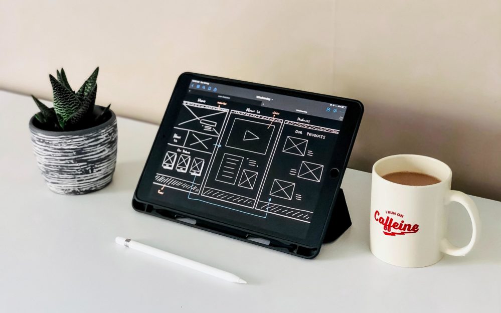 Wireframe sketches on an iPad
